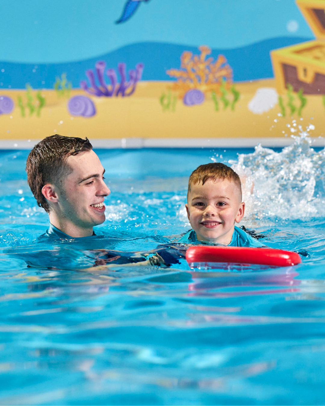 child and teacher child and teacher - JUMP! Swim Schools